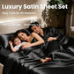 Family lying on a bed with a luxury satin sheet set, surrounded by plants.