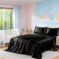 Children's bedroom with black satin sheet on bed, teddy bears, and wall mural.