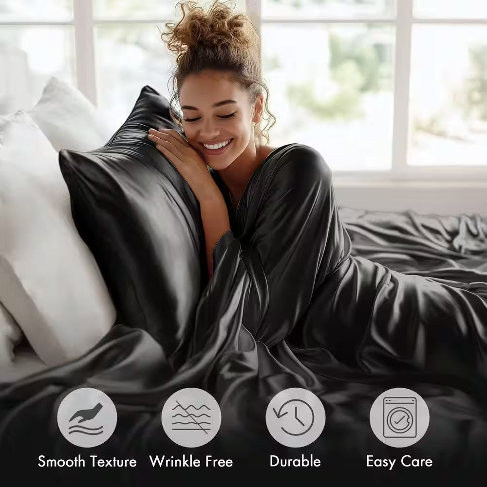 Woman wrapped in a black satin blanket with product features displayed.