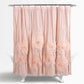 Pink shower curtain with floral patterns on a white background
