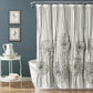 Shower curtain with floral patterns in a bathroom setting