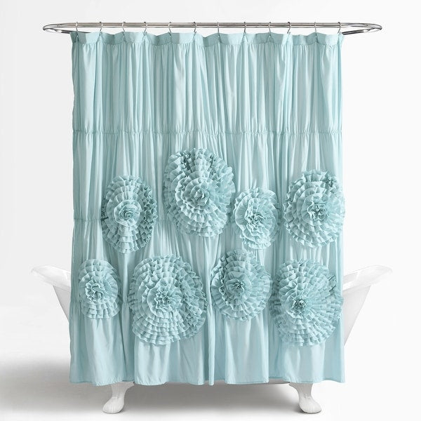 Light blue shower curtain with floral patterns on a white background