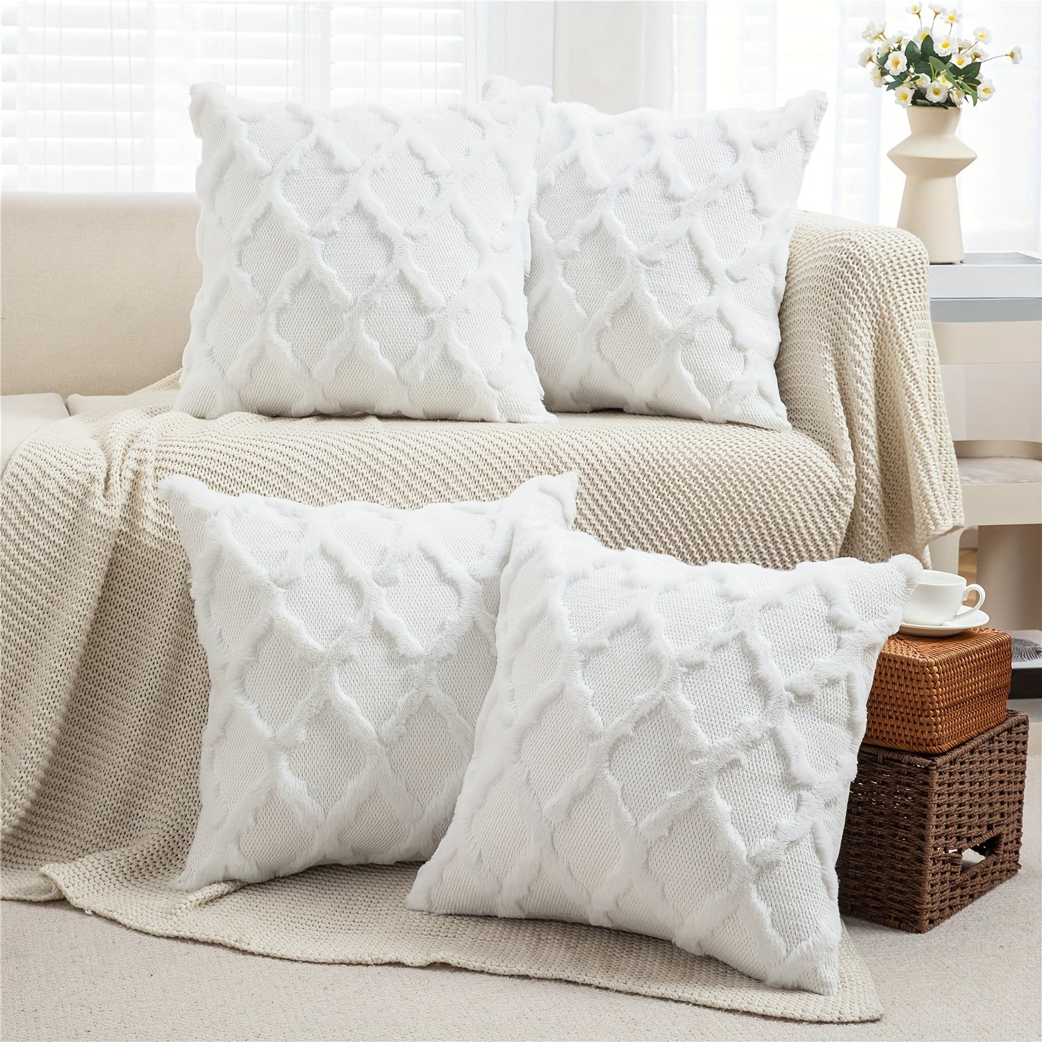 White textured pillows on a beige sofa with a neutral living room background