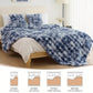 Blue textured blanket on a bed with size measurements displayed below.