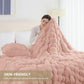 Person wrapped in a pink fluffy blanket on a bed with text 'SKIN-FRIENDLY' and description.