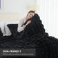 Woman wrapped in a black blanket in a bedroom setting with text 'SKIN-FRIENDLY'.