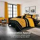 Modern bedroom with yellow and black bedding set, gray chair, and large windows.