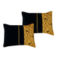 Two black and gold patterned pillows on a white background