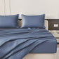 Blue striped bedding set on a bed in a bedroom setting.