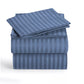 Stack of blue striped bed sheets on a white background