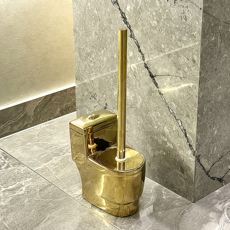 Gold toilet brush holder on a marble bathroom floor