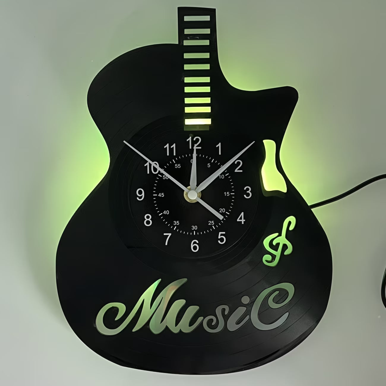 Guitar-shaped wall clock with 'Music' text and glowing green accents on a white background