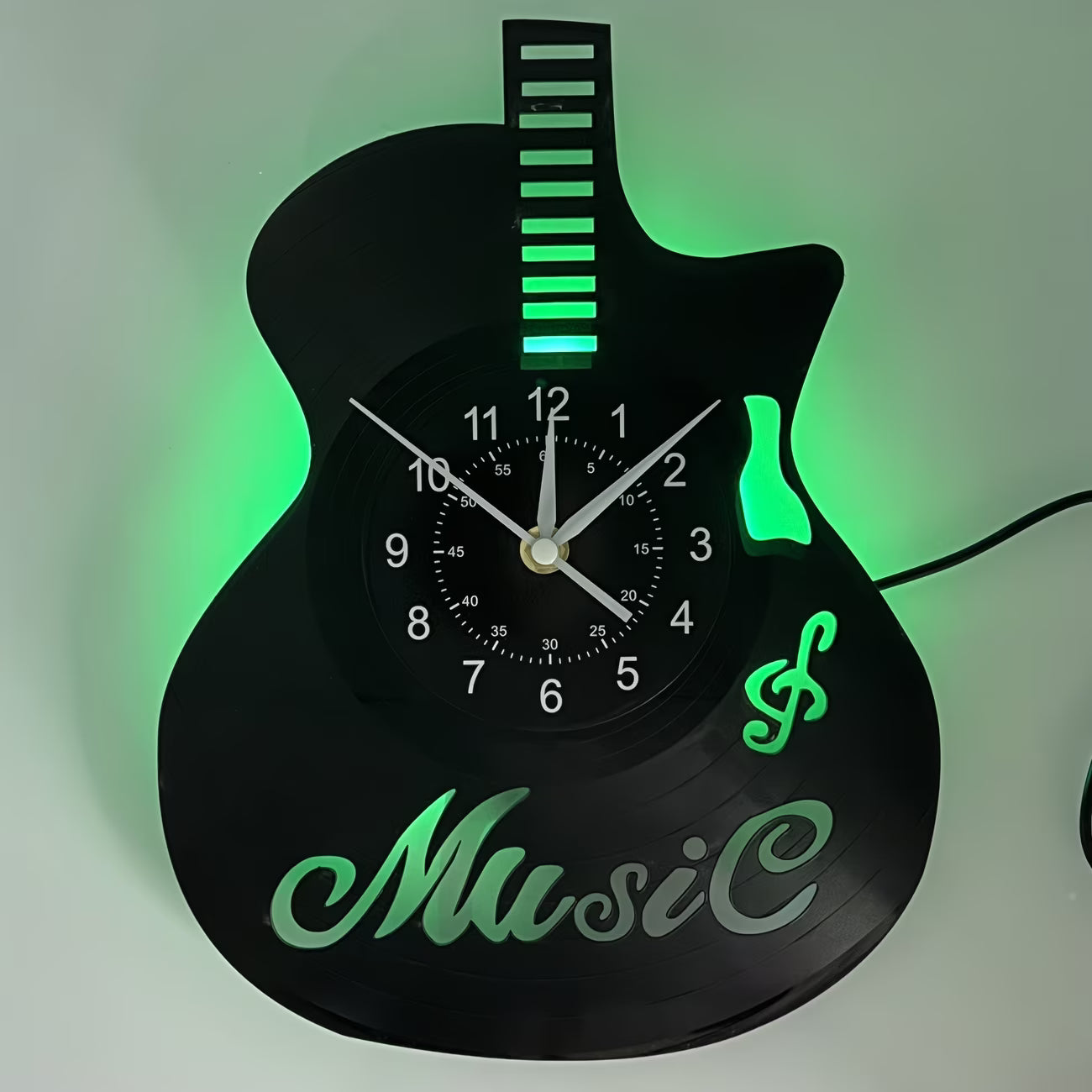 Guitar-shaped wall clock with green neon lights on a white background