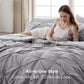 Woman sitting on a bed with gray bedding, text 'All-in-One Style Complete Set, Cohesive Look'.