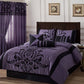 Purple and black bedding set on a bed with matching curtains and wall art.