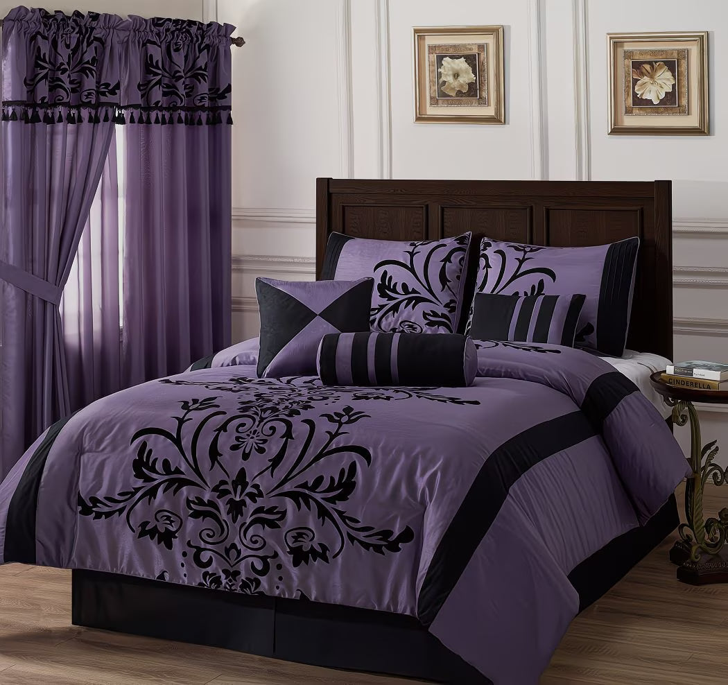 Purple and black bedding set on a bed with matching curtains and wall art.