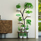 Decorative plant stand with various potted plants in a room setting.