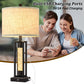 Table lamp with dual USB charging ports and text indicating fast charging capabilities, shown with a couple using a smartphone.