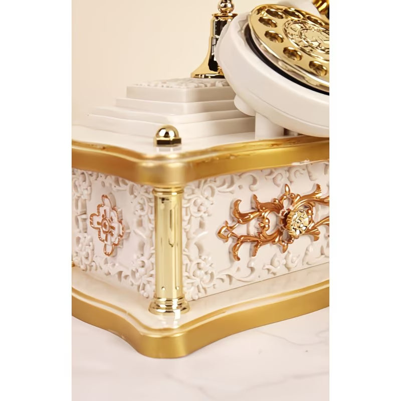 Decorative white and gold clock with intricate designs on a white background
