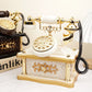 Vintage-style telephone with gold and white design on a light background