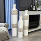 Three decorative vases with a modern interior setting
