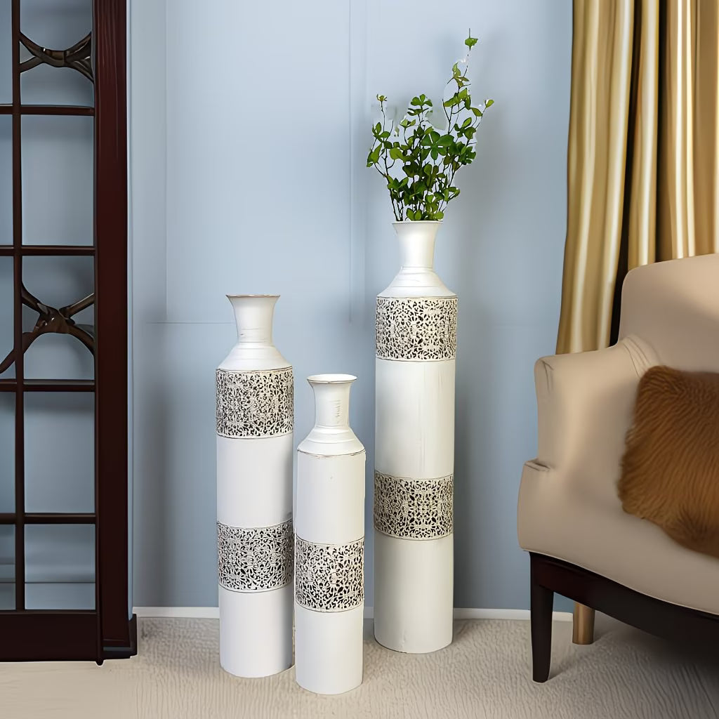 Decorative vases with intricate patterns in a living room setting.