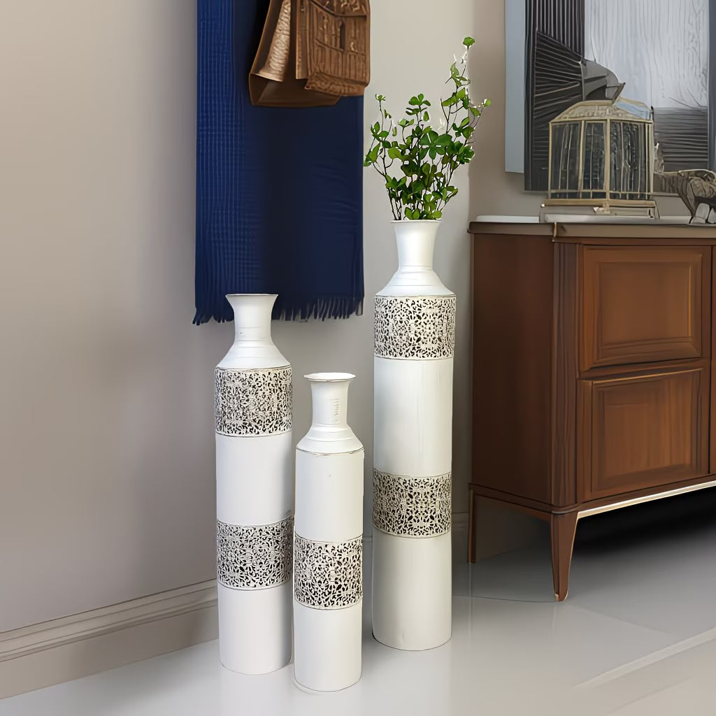 Decorative vases with intricate patterns in a room setting.