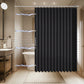 Black shower curtain in a bathroom setting with electrical effects.