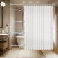 Bathroom with a white shower curtain, toilet, sink, and tiled walls.