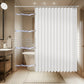 Bathroom with a white shower curtain, toilet, sink, and tiled walls.