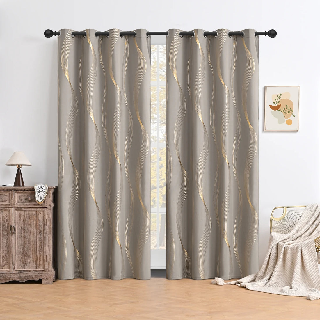 Pair of gray curtains with a wavy pattern in a room setting.