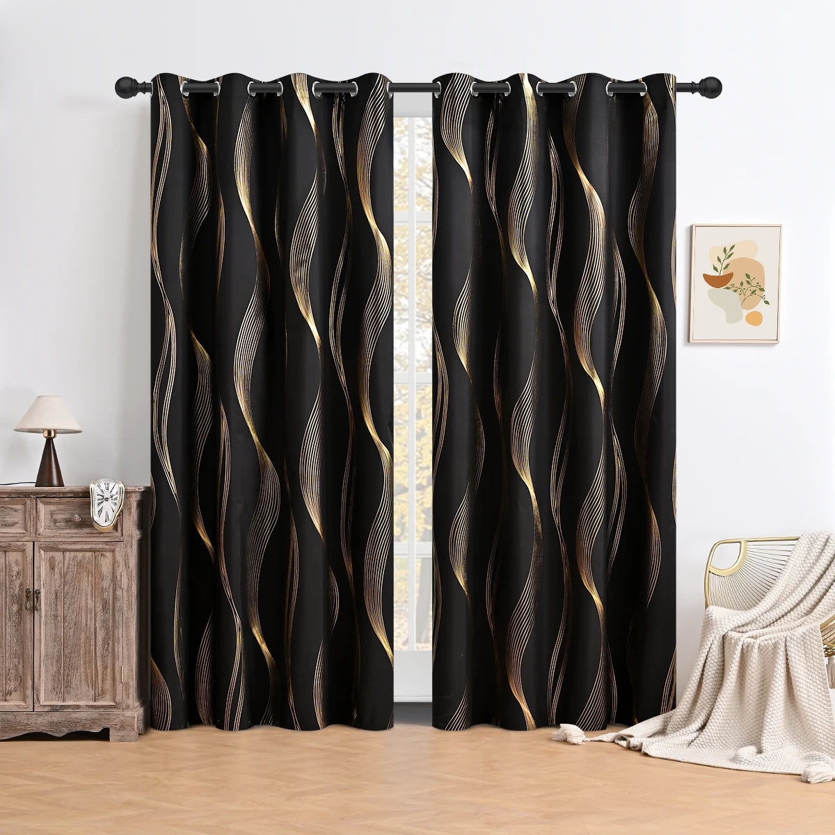 Black curtains with gold wavy patterns in a room setting.