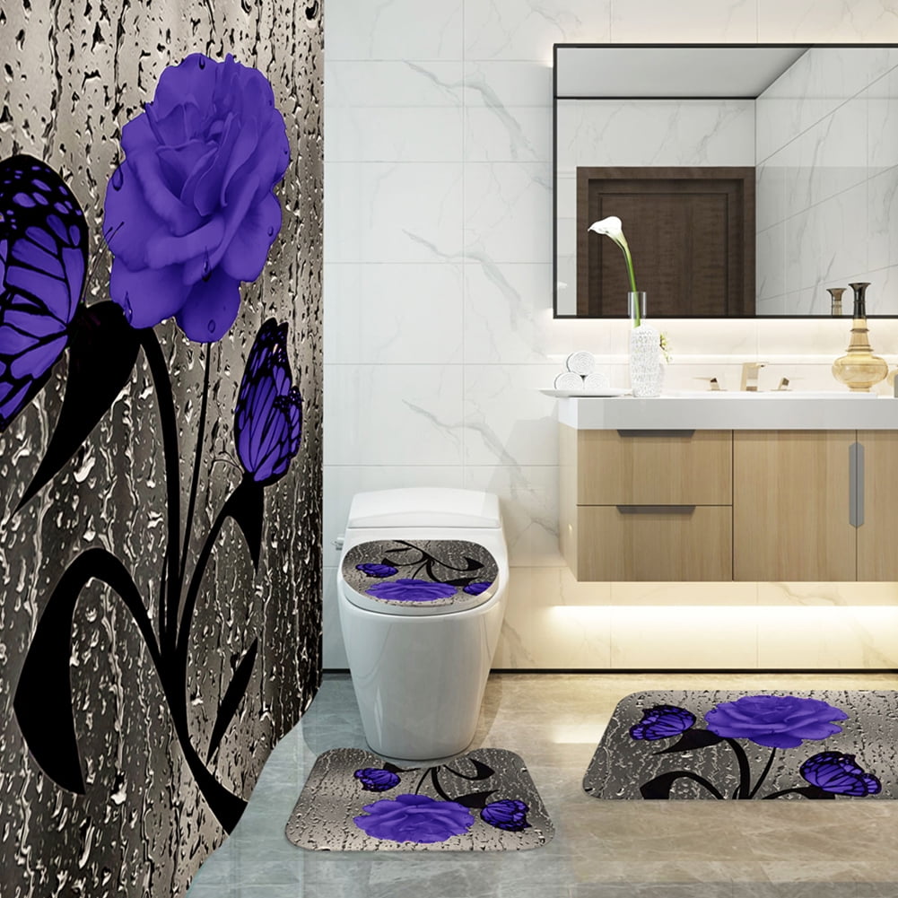 Bathroom with decorative purple flowers and black butterflies on bath mats.