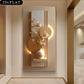 Decorative wall art with floral elements and geometric shapes in a modern interior setting.