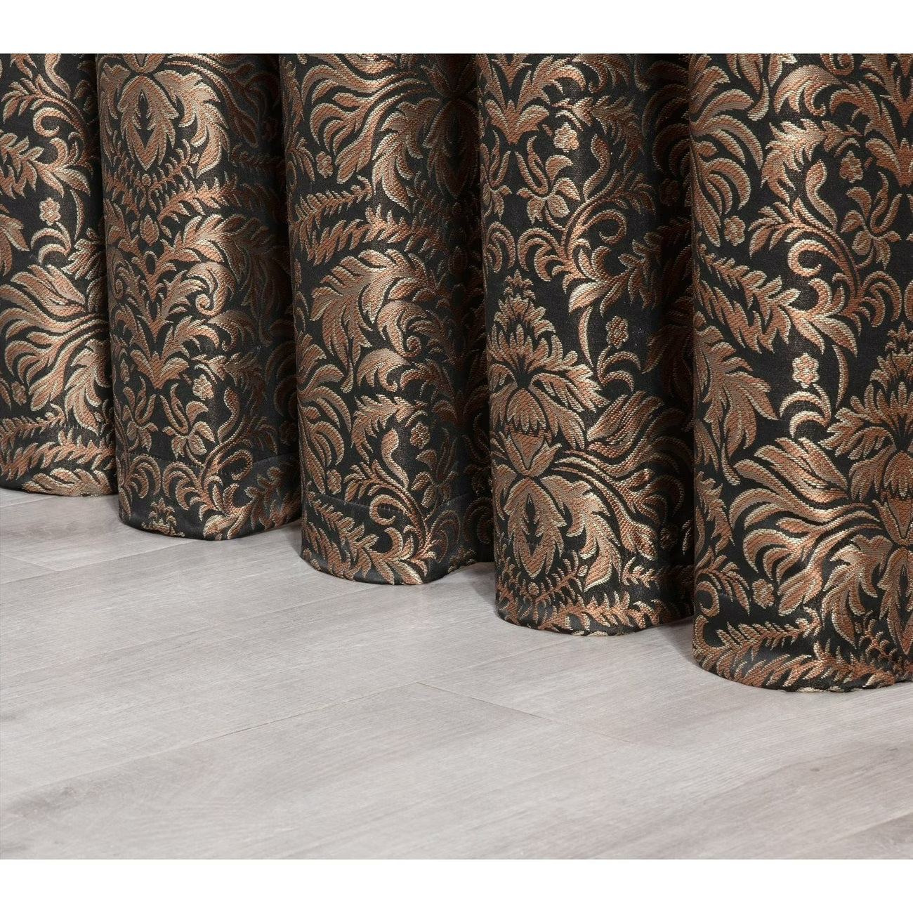 Patterned curtains on a wooden floor